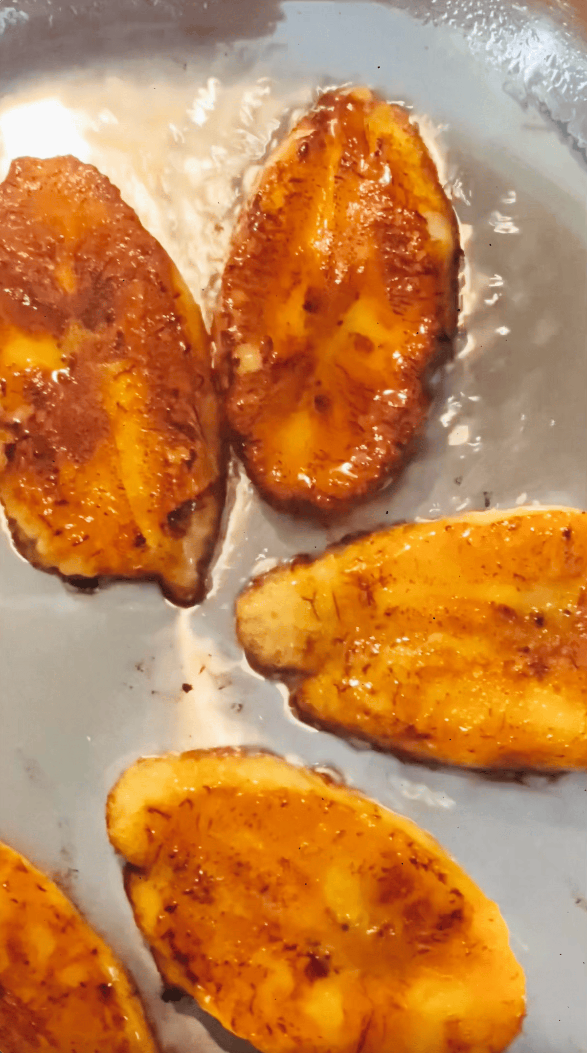 golden sweet plantains on a skillet